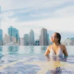 portrait-beautiful-young-asian-woman-relax-happy-smile-leisure-around-outdoor-swimming-pool